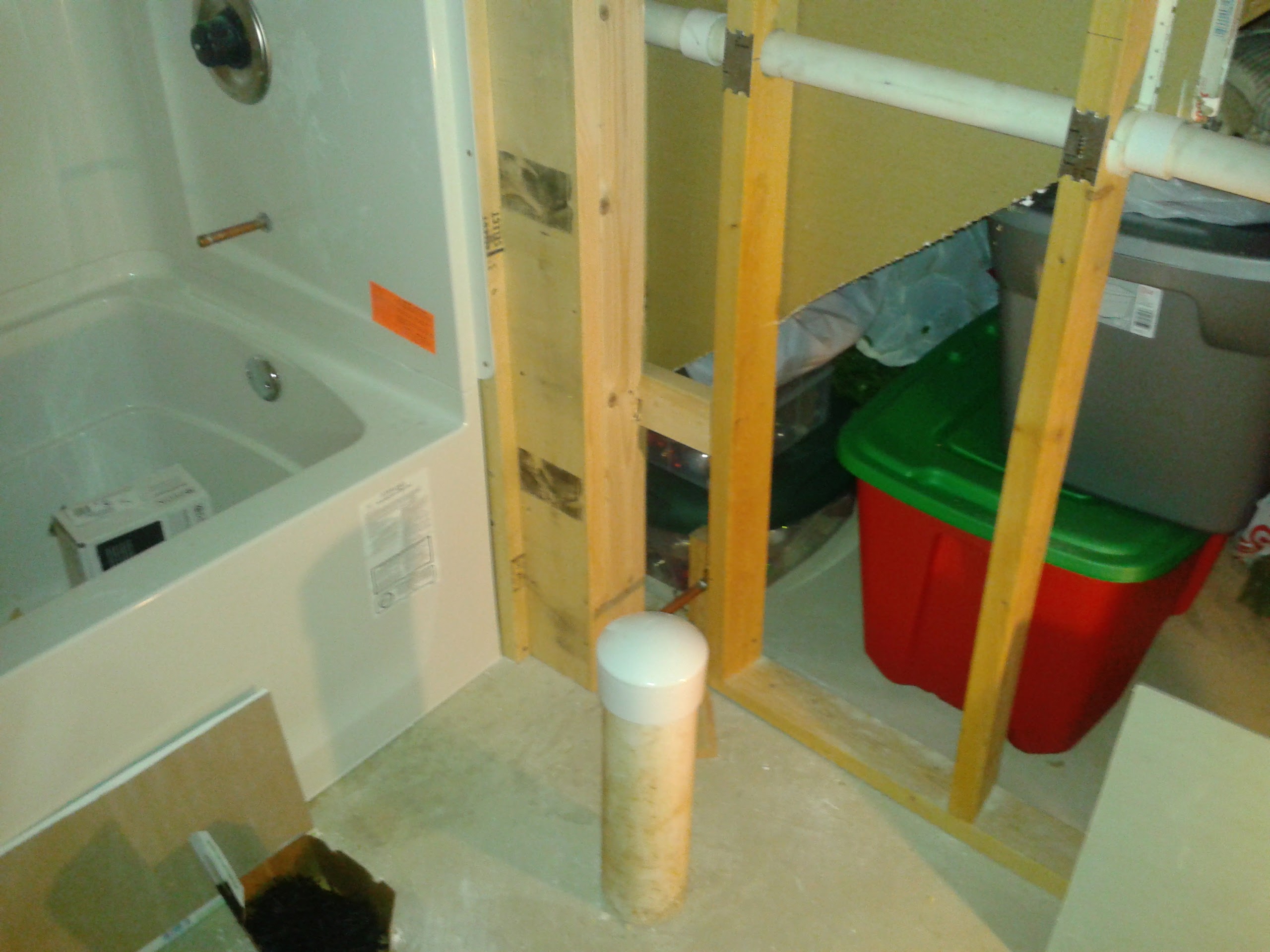 Rough plumbing and framing during bathroom remodel