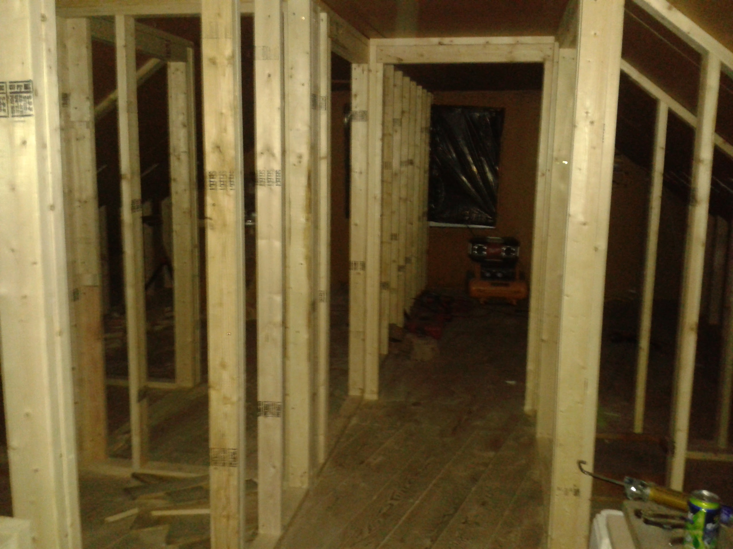 New wall framing in progress for attic room conversion