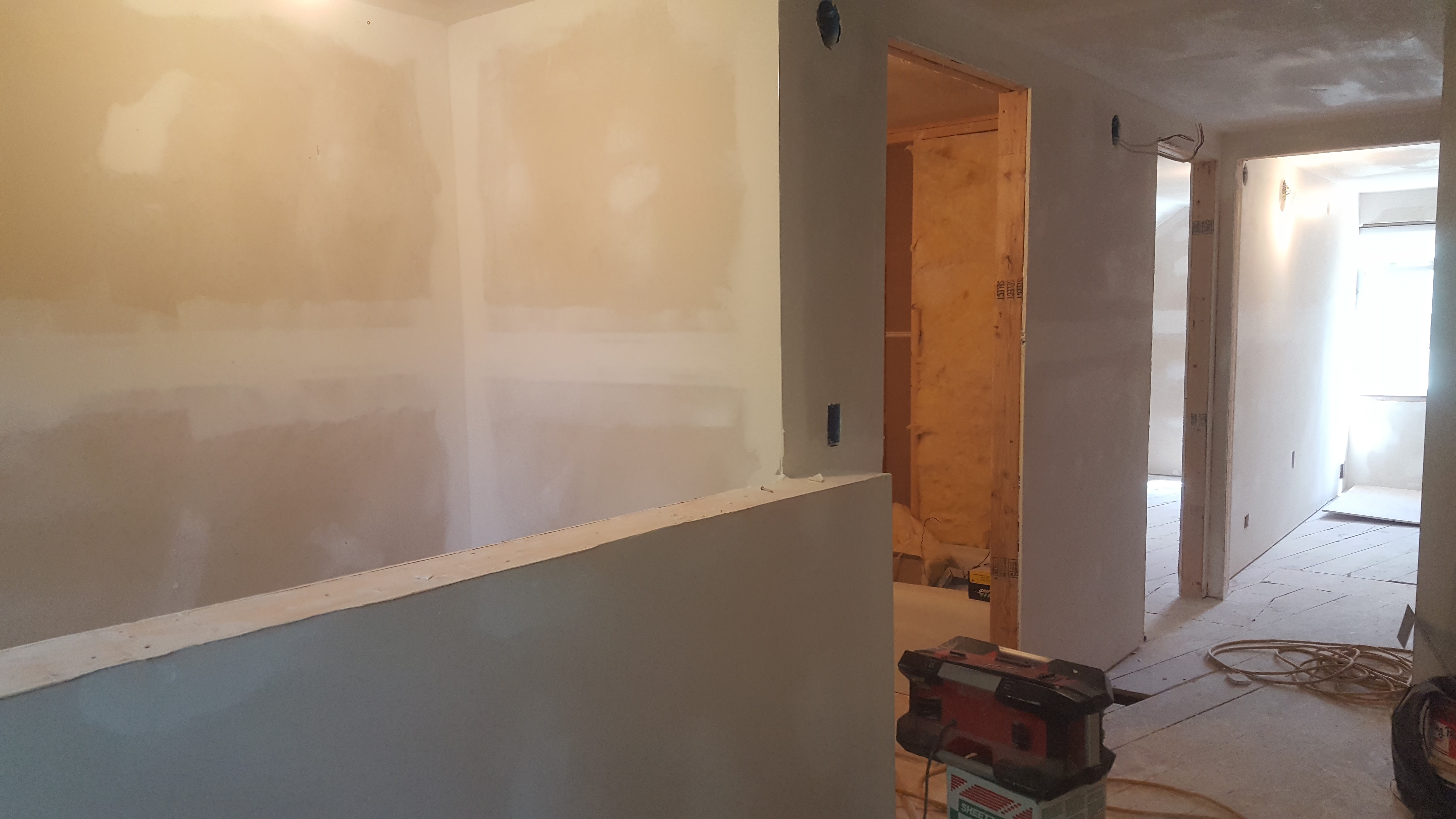 Drywall installed in hallway during interior remodel