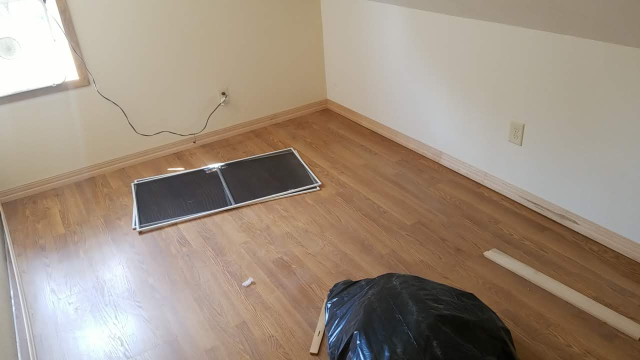 New hardwood flooring installed in upper floor bedroom